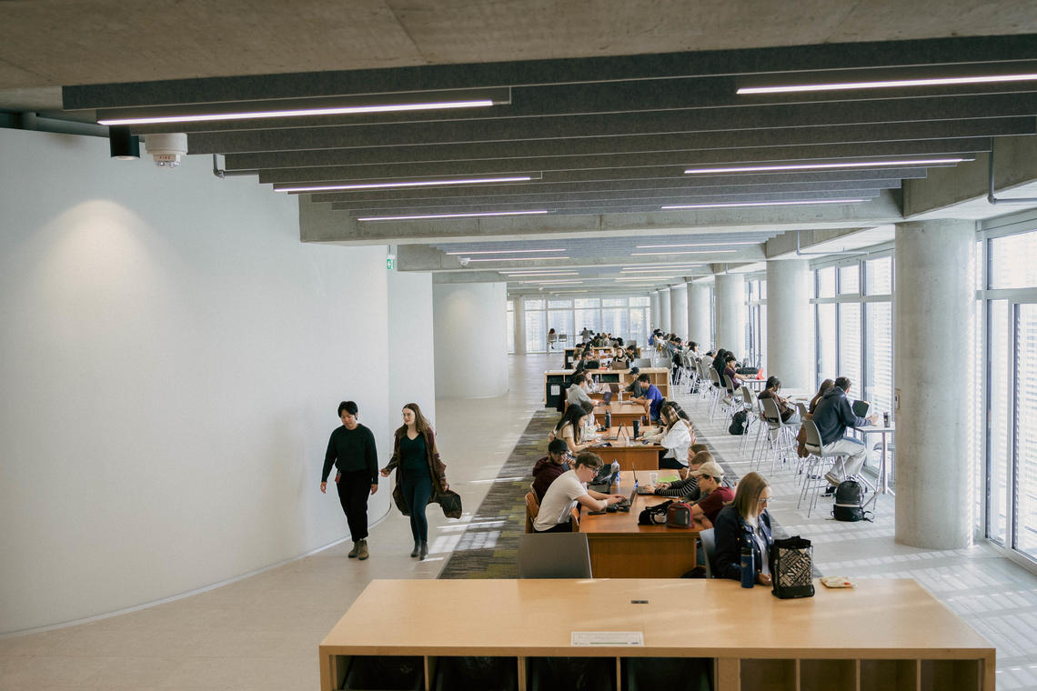 Rows of mid-century tables on the third floor of Hunter Student Commons were saved and restored from the former MacKimmie Block, just one way the past is honoured as part of the new building. 